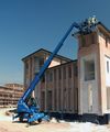 Телескопический погрузчик Genie GTH -5022 R на строительной площадке