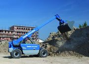 Телескопический погрузчик Genie GTH-2506 c установленным ковшом