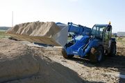 Погрузчик телескопический Genie GTH 4013 EX на строительной площадке
